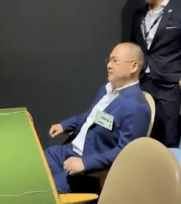 Frank Song seated in the United Nations General Assembly